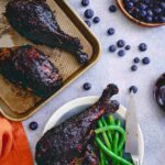 These blueberry balsamic BBQ turkey legs are grilled to perfection while coated with this deliciously easy summer BBQ sauce giving the famous Disney dish a run for its money!