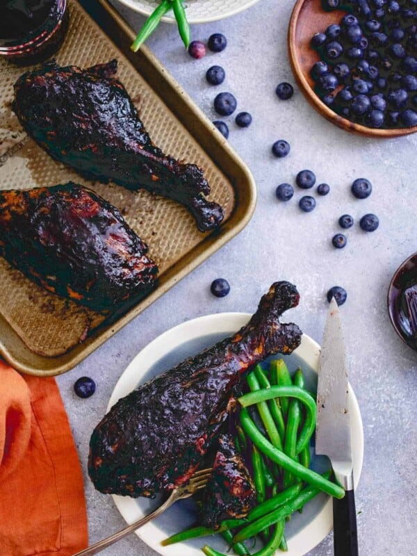 These blueberry balsamic BBQ turkey legs are grilled to perfection while coated with this deliciously easy summer BBQ sauce giving the famous Disney dish a run for its money!