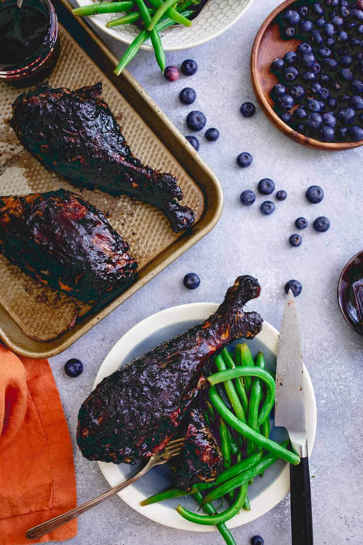 These blueberry balsamic BBQ turkey legs are grilled to perfection while coated with this deliciously easy summer BBQ sauce giving the famous Disney dish a run for its money!