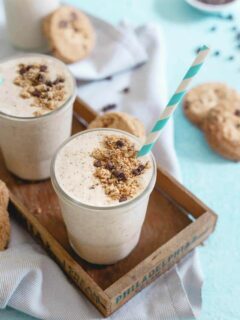 This chocolate chip cookie milkshake is made with maple pecan gluten-free cookies, coconut milk and cashew butter for a creamy cookie dough tasting treat!