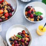 This summer fruit panzanella is full of sweet, ripe cherries, blueberries, grilled nectarines, toasted gluten-free blueberry muffins and a sweet citrus dressing. Spoon over yogurt, vanilla ice cream or eat as is for a light, summer-filled treat.
