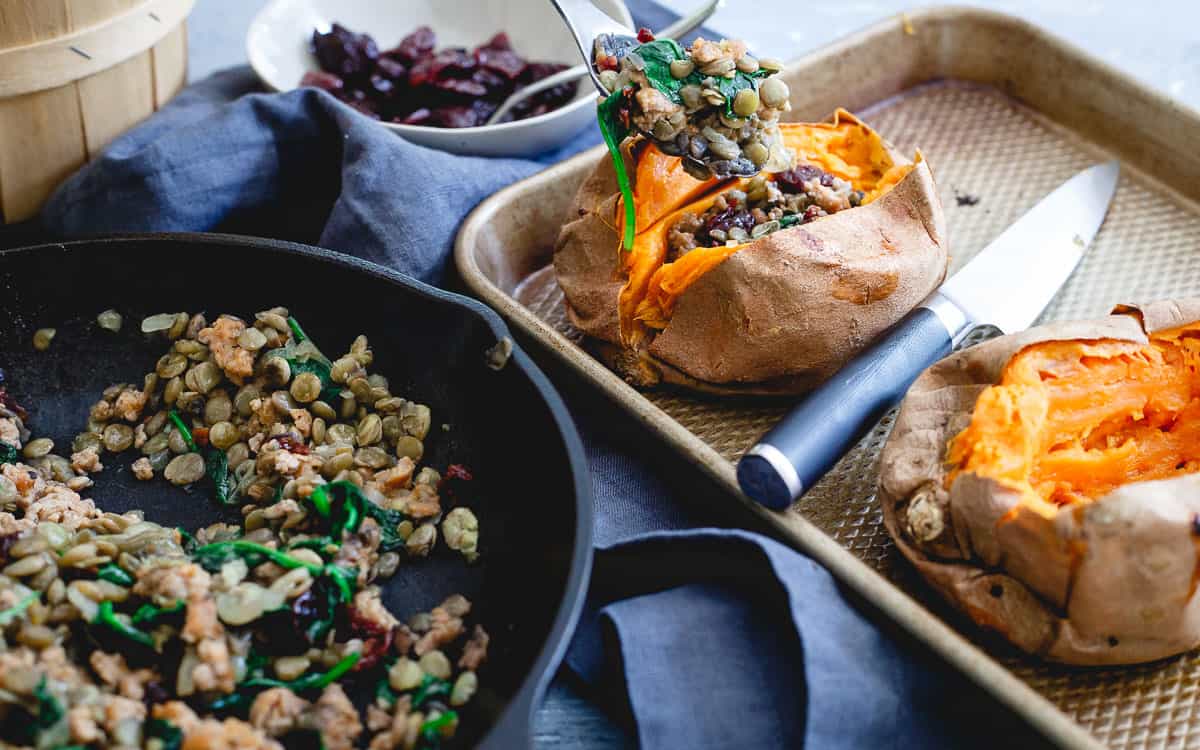Stuffed with Italian turkey sausage, hearty lentils, baby spinach and sweet tart cherries, these roasted sweet potatoes are a perfect dinner for the upcoming cooler nights.