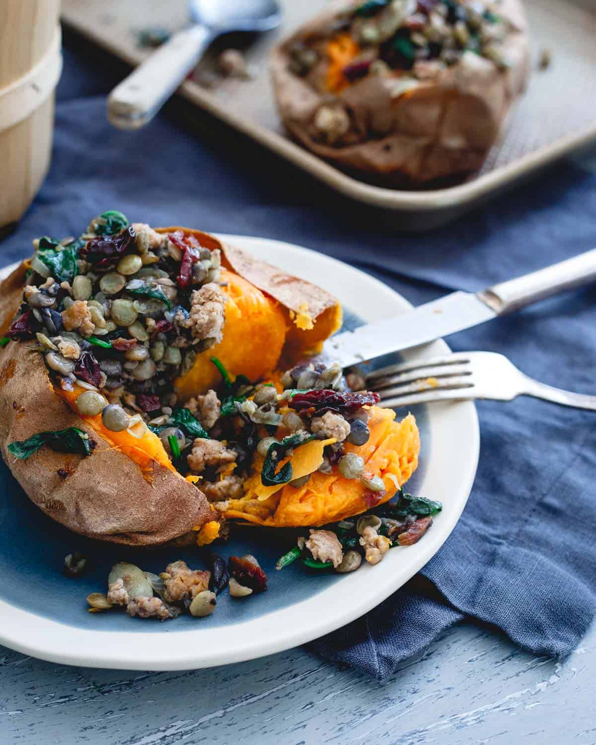 Savory lentils and turkey sausage are given a sweet bite with the addition of dried tart cherries in these stuffed sweet potatoes.