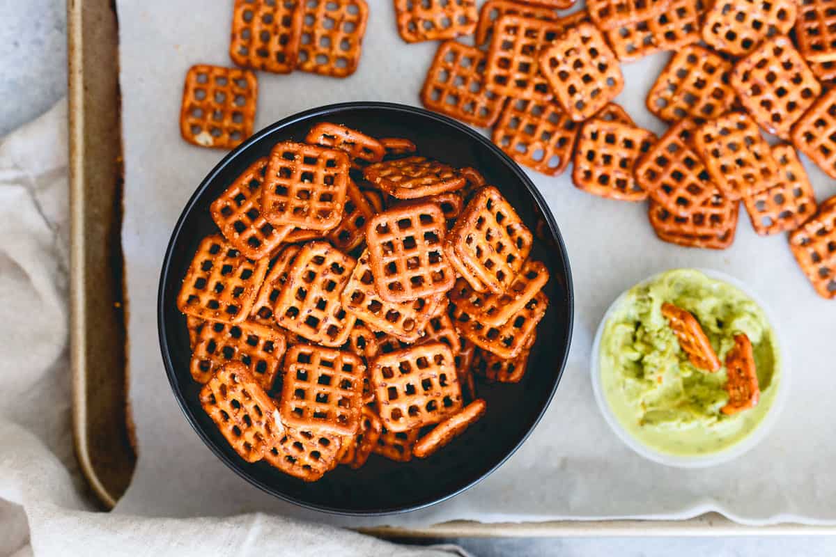 Homemade spicy seasoned pretzels are the perfect snack to munch on while you make dinner. Grab some Sabra singles and dip away!