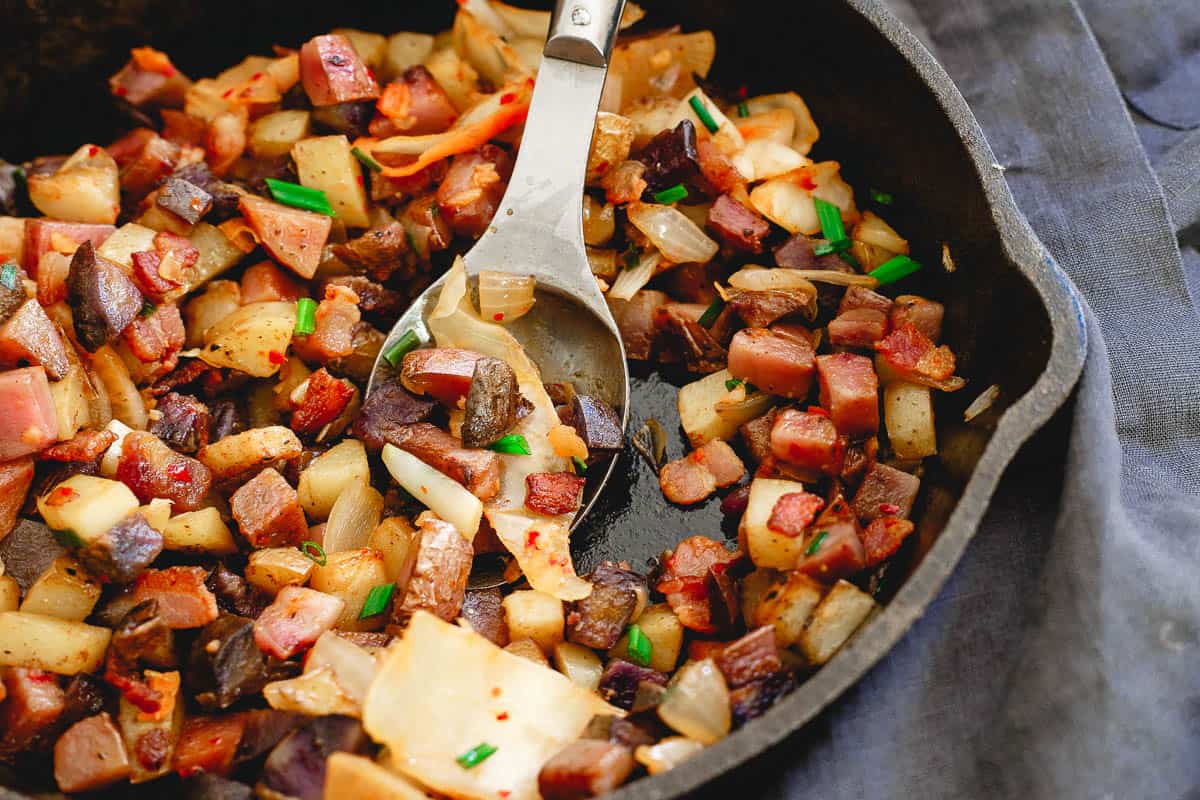 Bacon is optional in this kimchi potato hash but a welcome salty kick to an easy breakfast made all in one skillet. Add an egg or two on top and it's a complete meal!