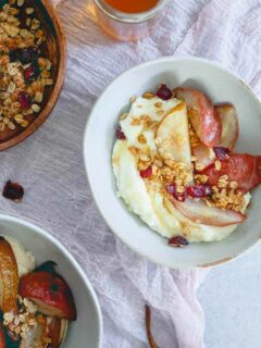 These whipped ricotta bowls are infused with orange and cardamom flavor then topped with roasted pears and cranberry granola for a fall treat!