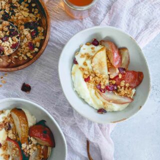 These whipped ricotta bowls are infused with orange and cardamom flavor then topped with roasted pears and cranberry granola for a fall treat!