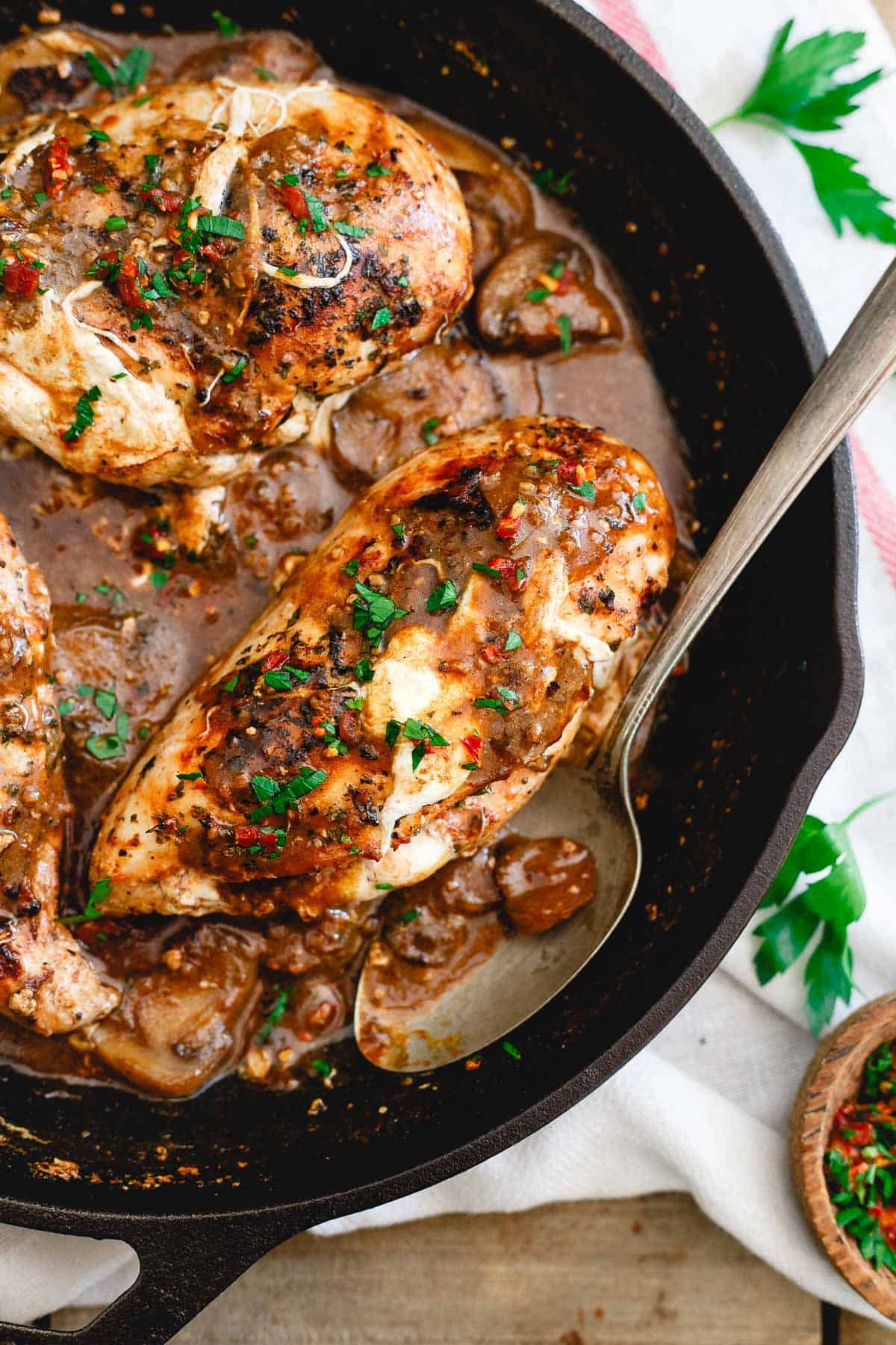 Melted mozzarella, tomato butter and fresh basil are stuffed into chicken cooked in a marsala mushroom sauce.