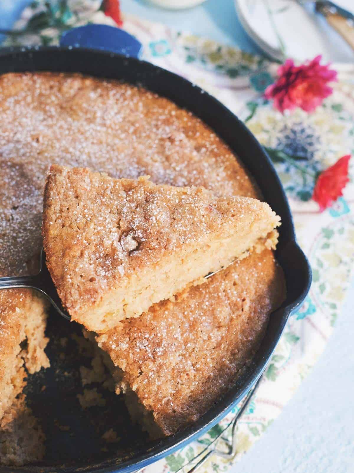 Applesauce raisin skillet cake with a slice removed.