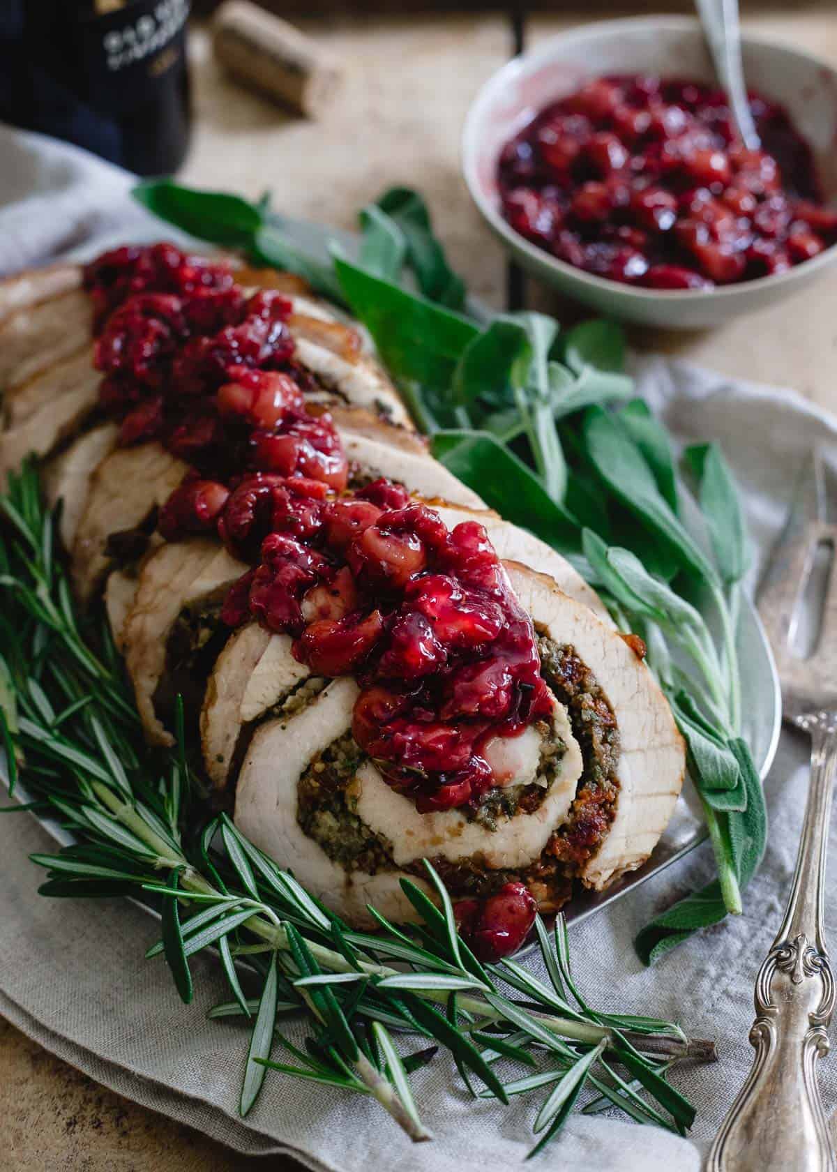 This turkey roulade is stuffed with tart cherries, chestnuts and herbs. It's topped with a red wine soaked cherry sauce and makes for a beautiful (and easy!) holiday dish.