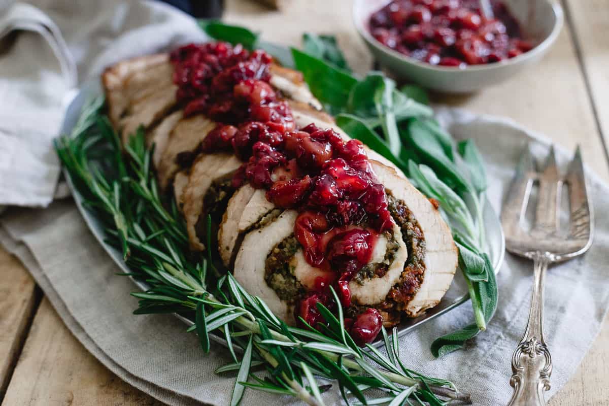 Try this gorgeous tart cherry chestnut stuffed turkey roulade topped with red wine soaked cherries for your winter holiday spread.