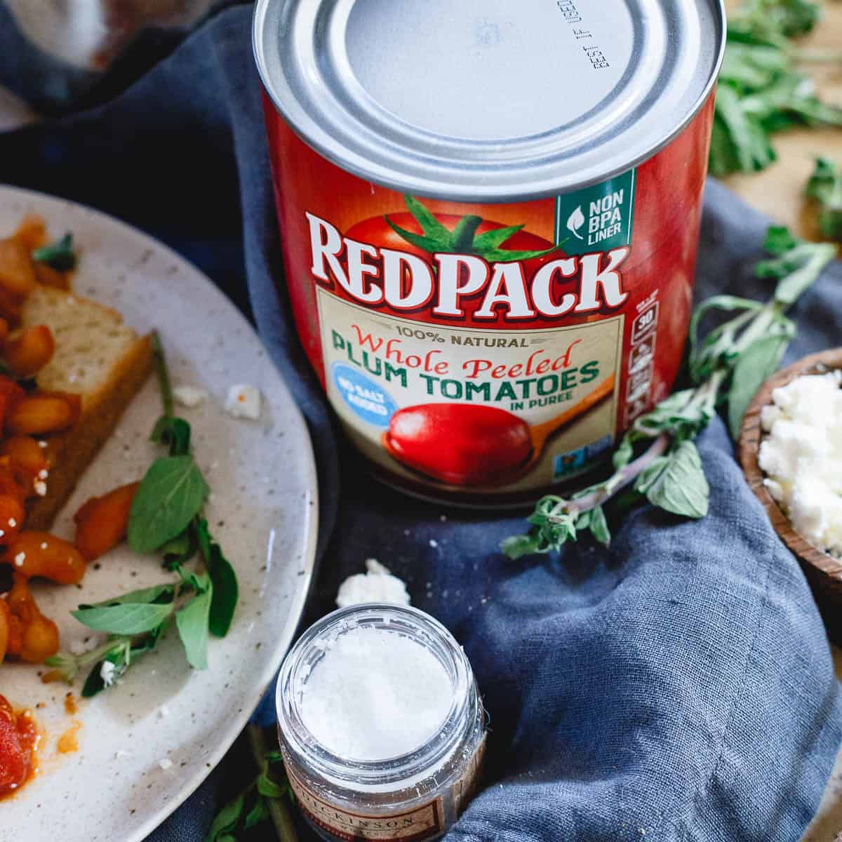 RedPack whole peeled plum tomatoes give this hearty white bean dish a lovely tomato flavor. Combined with bacon and onions, it's a cozy meal perfect for winter.