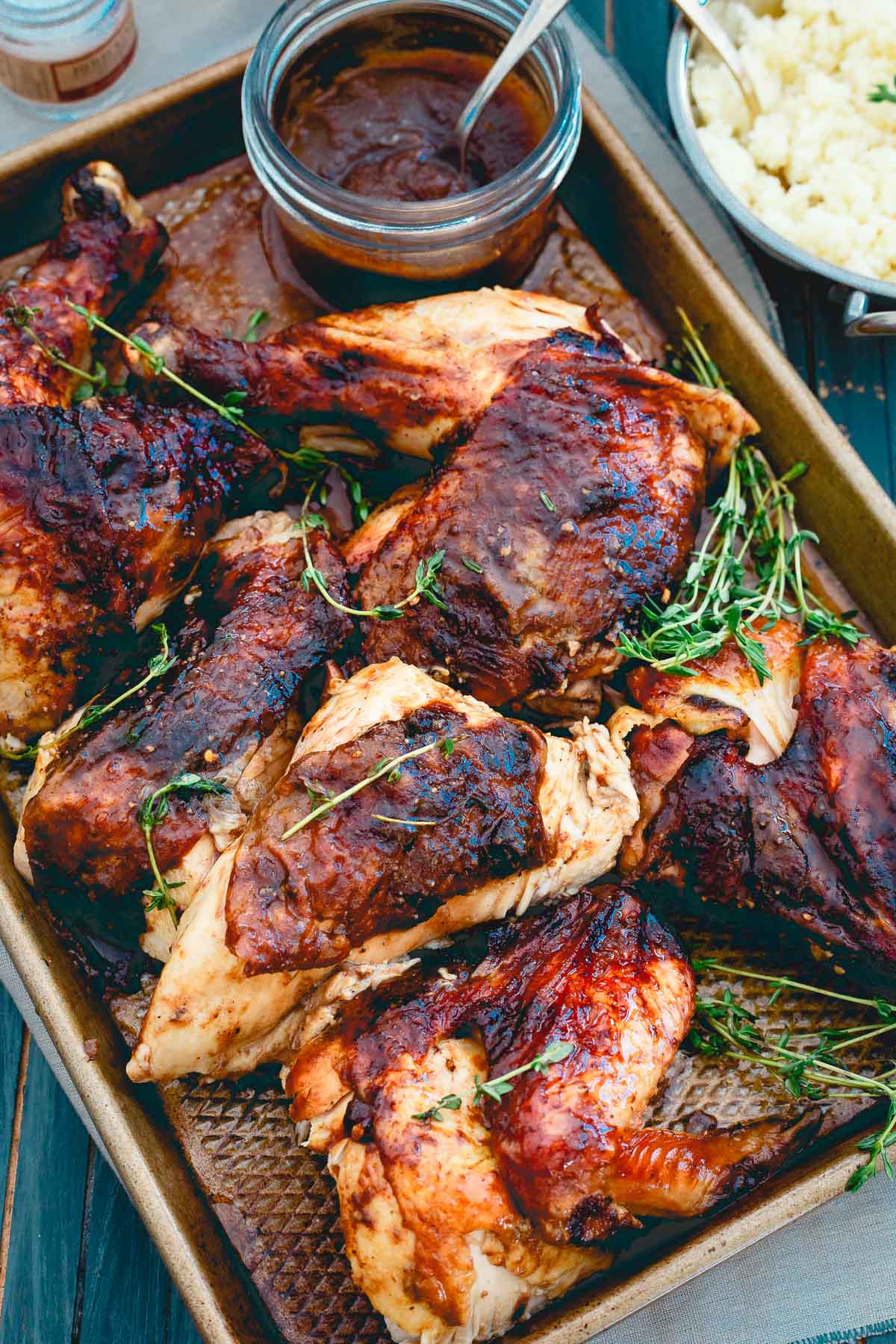 Sweet and savory apple butter is used as a saucy glaze on this roasted chicken for a great Sunday night meal.