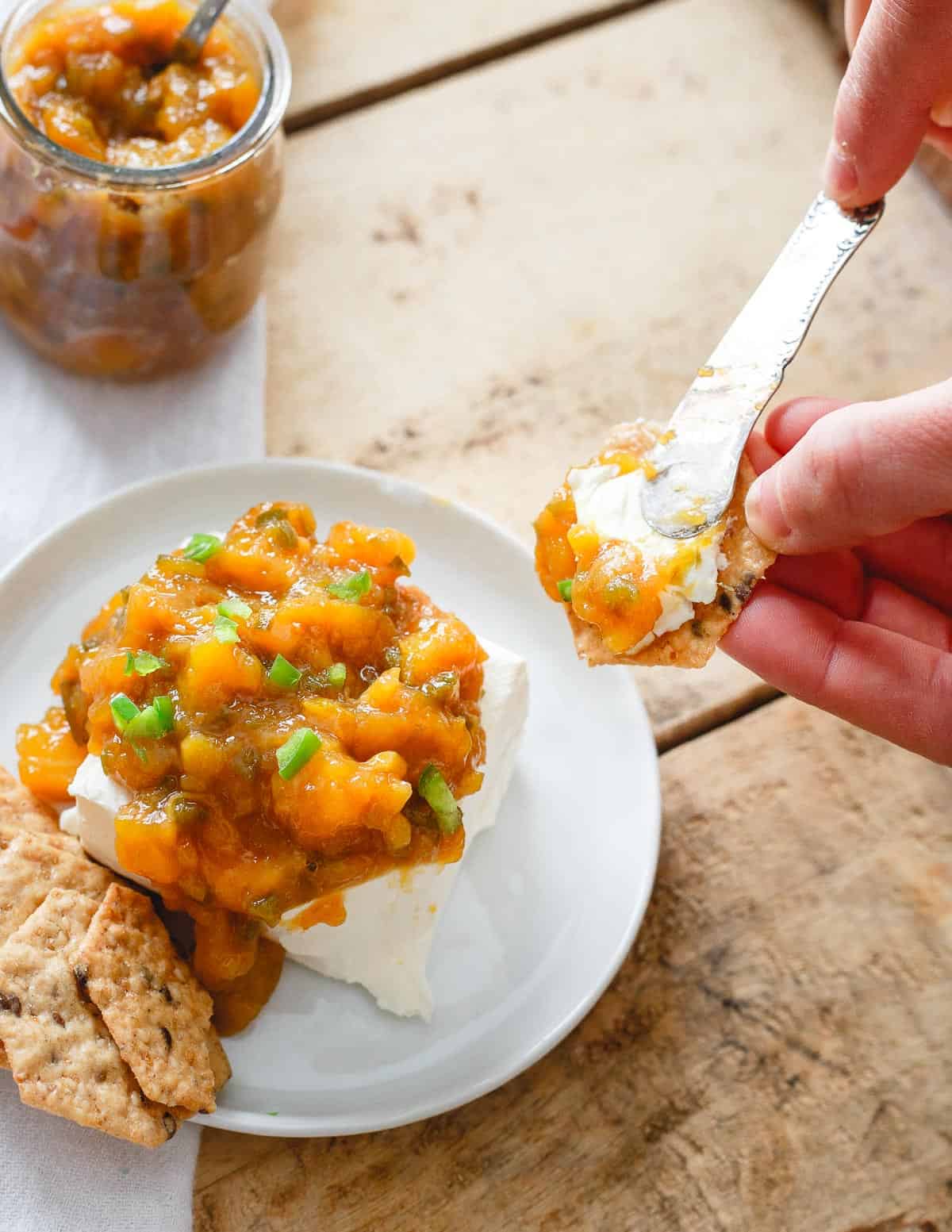 Jalapeno mango jam, a smear of cream cheese and your favorite cracker make for a delicious snack.