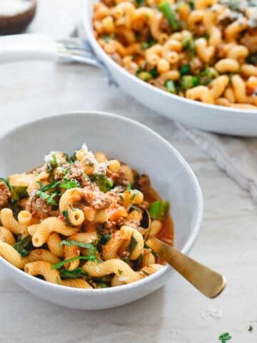 This lamb ragu is a spicy, spring inspired one-skillet dinner. Cavatappi pasta, crushed tomatoes and harissa paste make it flavorful and hearty.