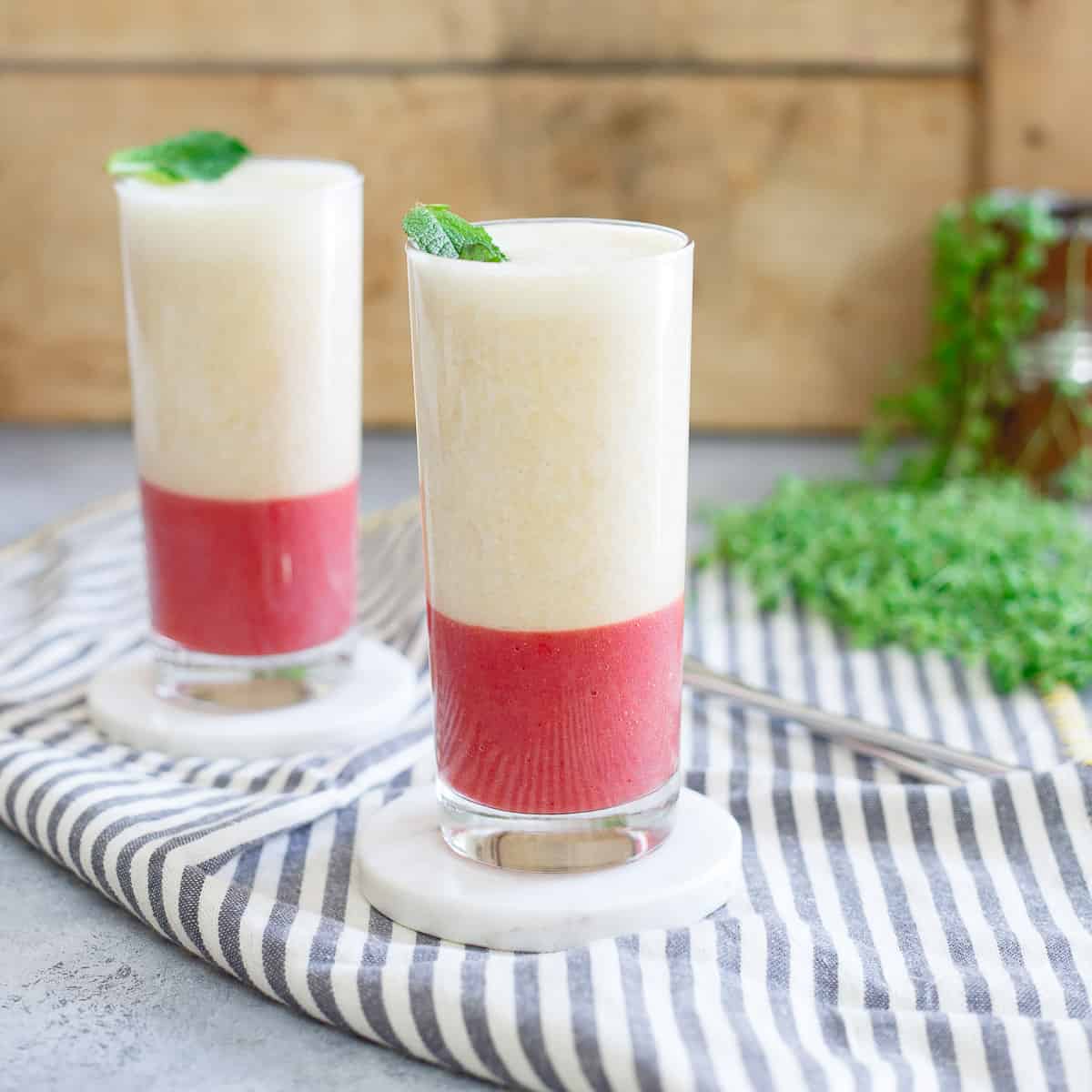 Layered strawberry ginger peach smoothie