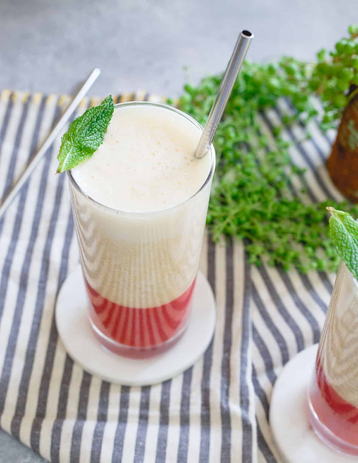 The perfect springtime smoothie - this layered strawberry ginger peach smoothie is fun, easy and tasty!