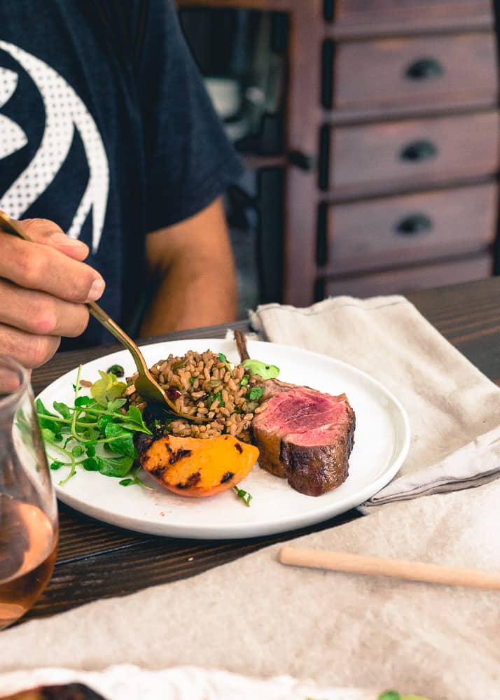 Wild rice, grilled peaches and a watercress salad go perfectly with these grilled lamb chops with peach honey.