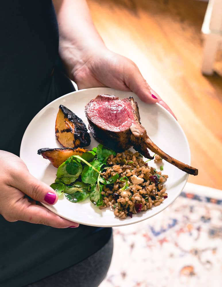 A simple summer meal of grilled lamb chops, grilled peaches, wild rice salad and watercress will impress any guest.