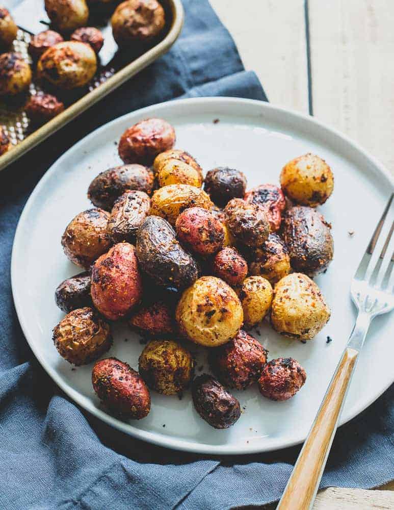 Peri Peri potatoes are roasted to perfection and coated in a deliciously aromatic Portuguese spice mixture that makes a great side dish to any dinner.