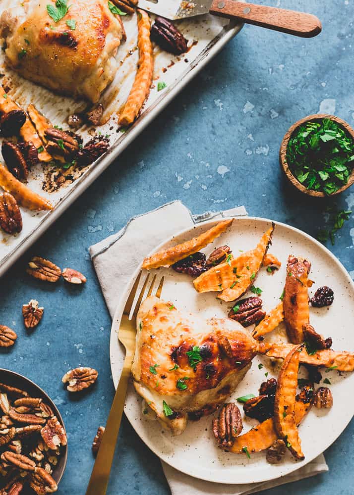 This 30 minute meal of chicken thighs, sweet potatoes and pecans coated in a delicious mustard maple sauce cooks all on one pan!