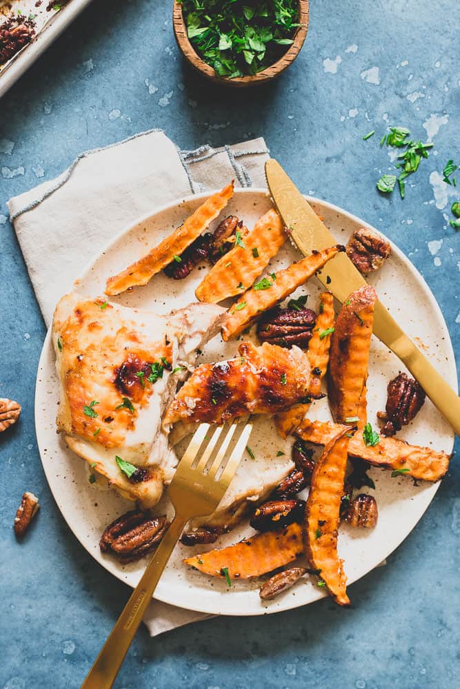 Try this easy fall inspired sheet pan dinner of chicken thighs, sweet potatoes and pecans all roasted and tossed together with a sweet maple mustard sauce.