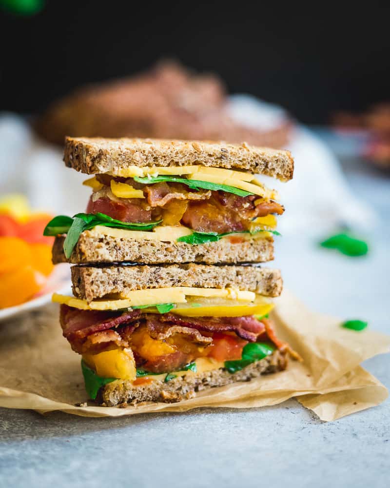 Basil and heirloom tomatoes put a seasonal spin on the classic BLTC (bacon, lettuce, tomato and cheese).