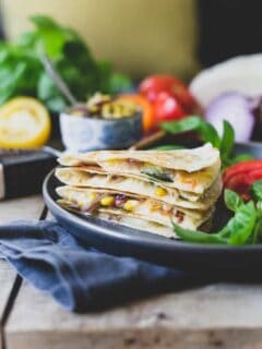 This summer harvest cheddar quesadilla is filled with juicy ripe heirloom tomatoes, fresh corn, basil and melted sharp cheddar cheese. A delicious way to celebrate summer's bounty.
