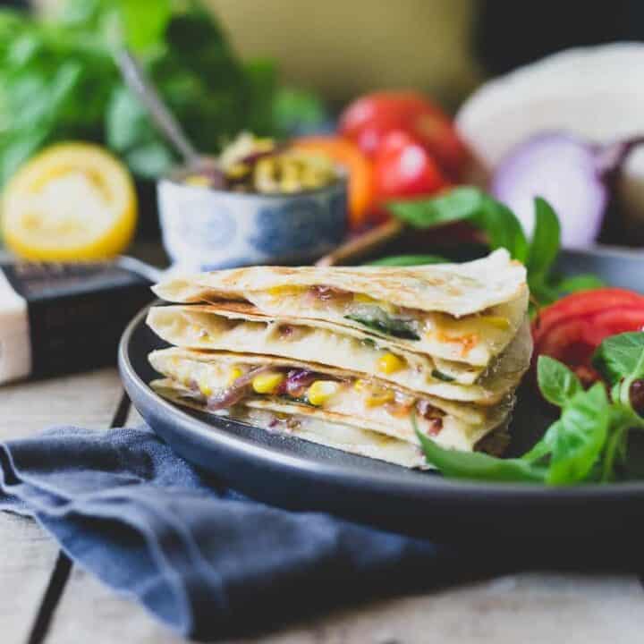 This summer harvest cheddar quesadilla is filled with juicy ripe heirloom tomatoes, fresh corn, basil and melted sharp cheddar cheese. A delicious way to celebrate summer's bounty.