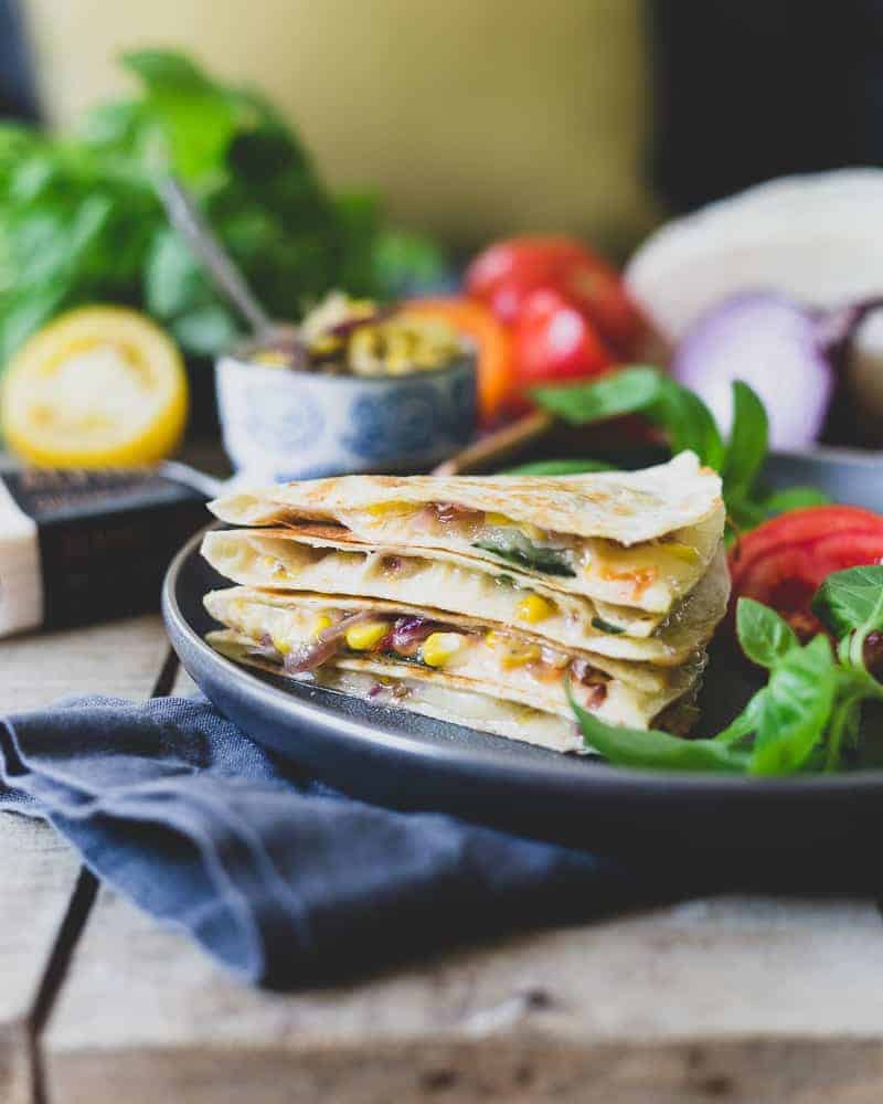 This summer harvest cheddar quesadilla is filled with juicy ripe heirloom tomatoes, fresh corn, basil and melted sharp cheddar cheese. A delicious way to celebrate summer's bounty.