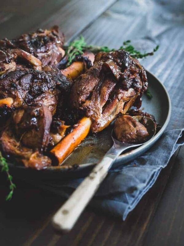 Braised lamb shanks with apple cider.