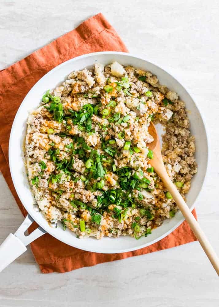 This 4-ingredient buffalo turkey cauliflower skillet makes a quick and easy, healthy dinner and doubles as a great meal-prep option for the week!