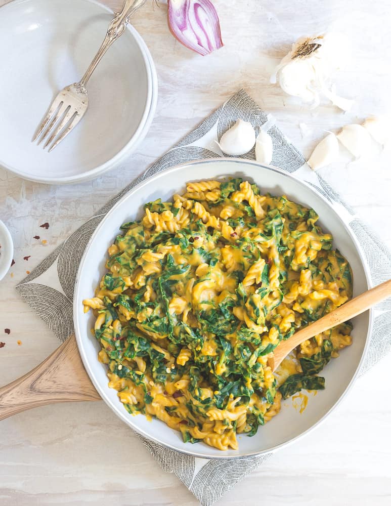 Creamy pumpkin, garlic and almond milk make a decadent sauce perfect with your favorite pasta and vegetable for a fall inspired meal.