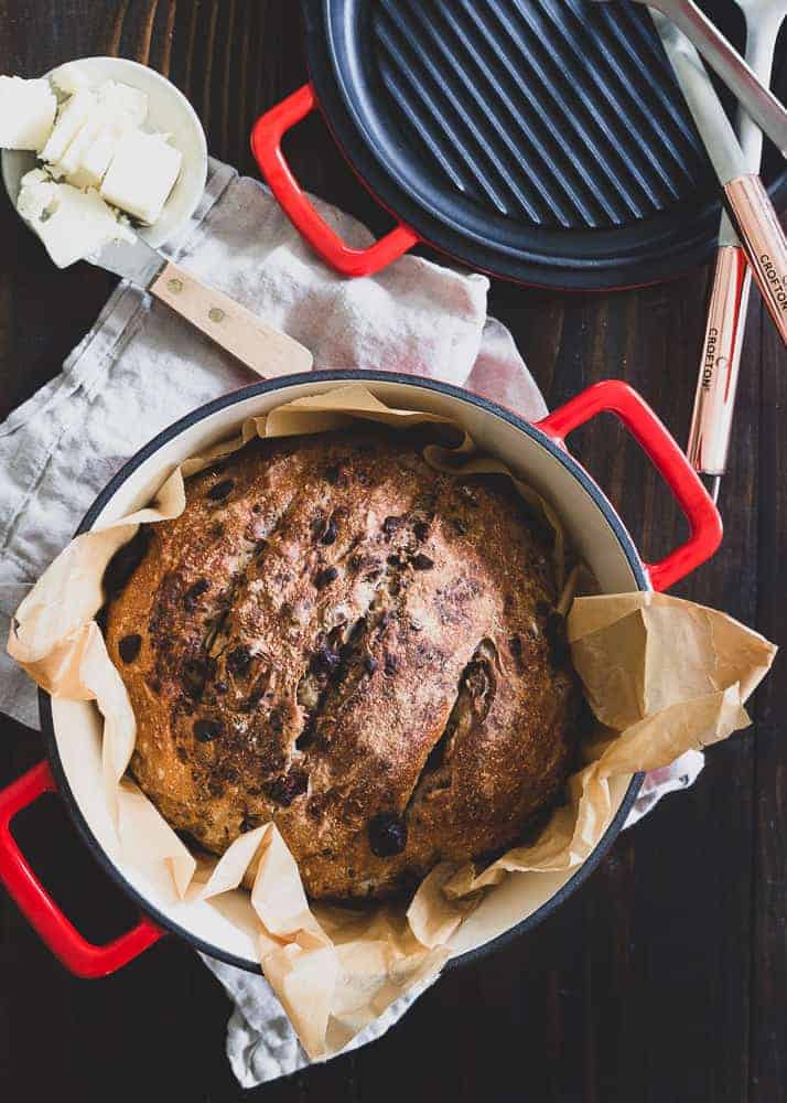 This Dutch oven bread is packed with cinnamon spices, cranberries, walnuts and dark chocolate. It makes a sweet loaf perfect for the holidays.