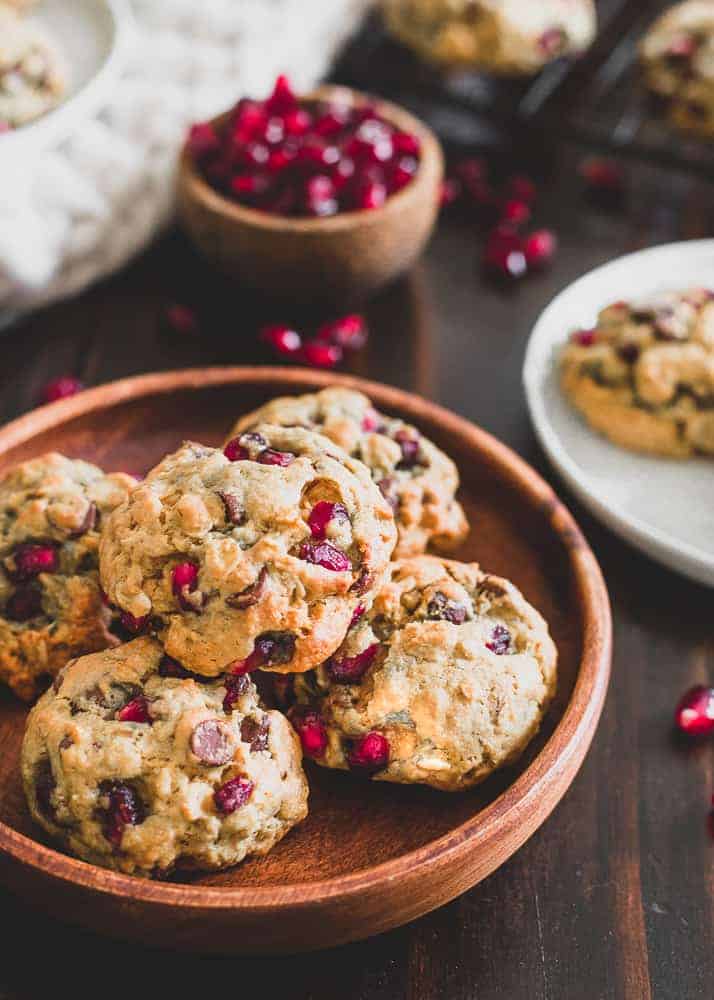 These pomegranate oatmeal chocolate chip cookies are flavored with orange zest and extract to make the perfect winter themed cookie. A great addition to your holiday baking!