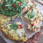 Slow cooker summer frittata topped with arugula.