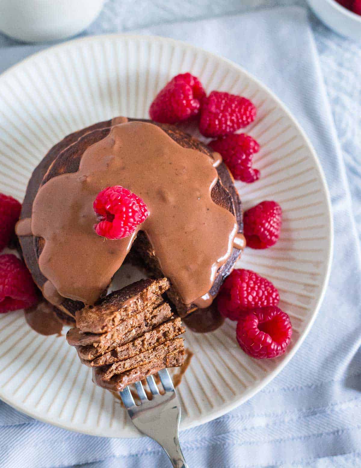 Simple 6 ingredient chocolate protein pancakes are an indulgent healthy breakfast.