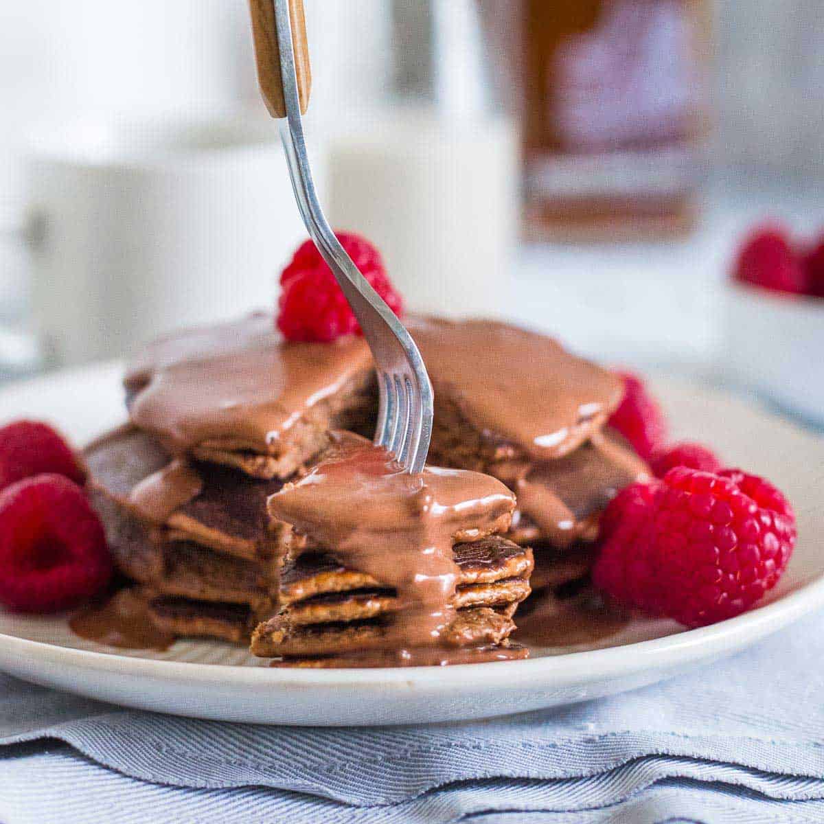 Make a batch of these chocolate protein pancakes with just 6 simple ingredients.