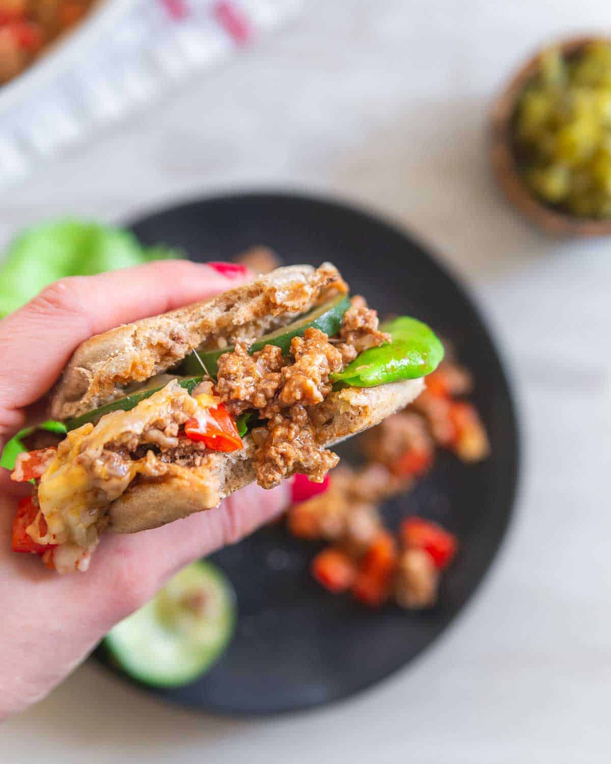 Lean ground beef, low-fat cheese and low sugar condiments make these healthier sloppy joes a great alternative to the traditional dinner.