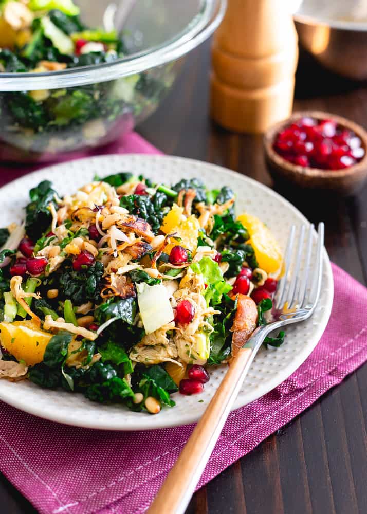 Crispy rotisserie chicken, pomegranates, oranges and toasted pine nuts are tossed with chopped kale and an orange dijon dressing.