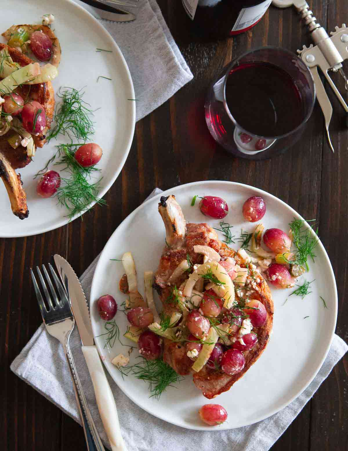 Grilled pork chops with grilled fennel and grapes is an easy and elegant meal made entirely on the grill.