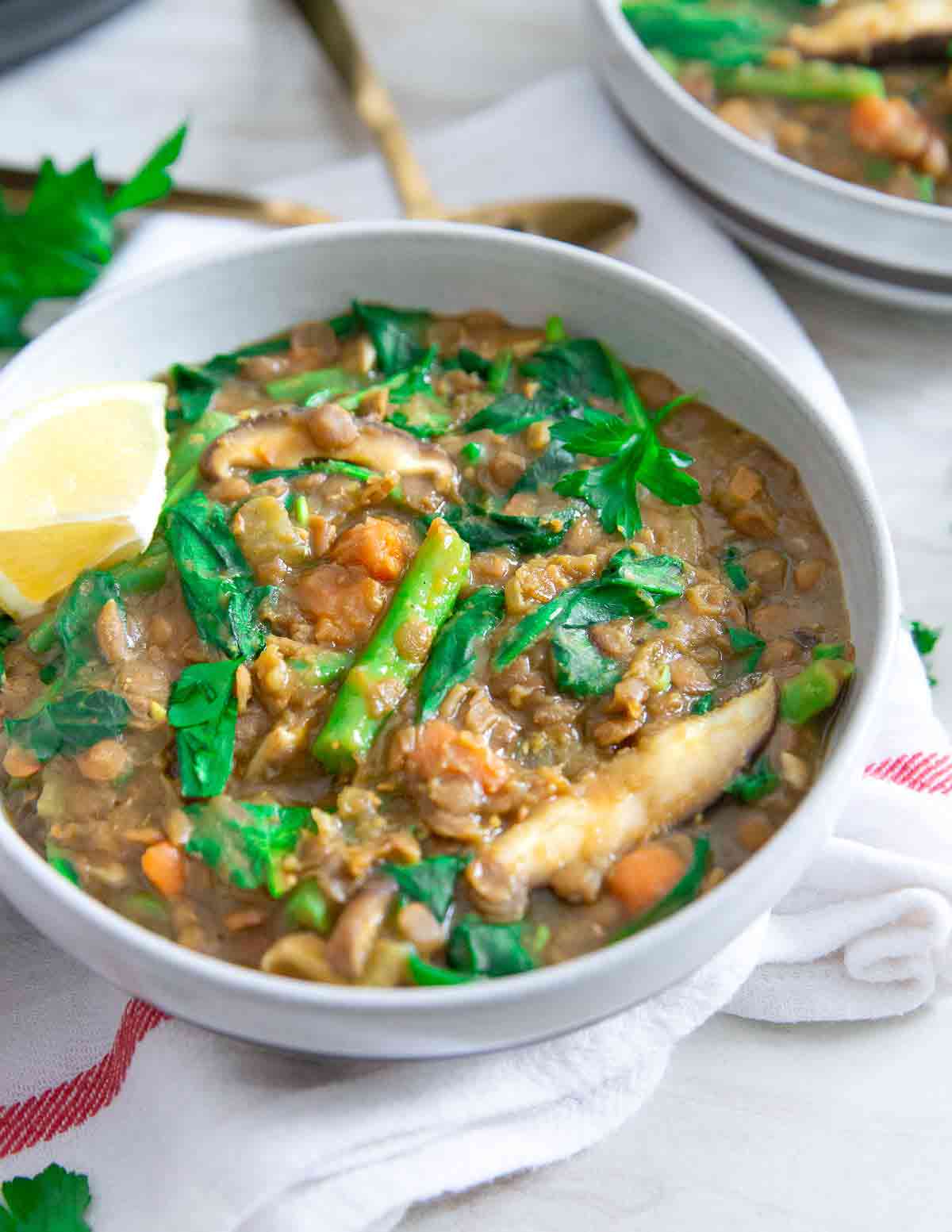 This lentil vegetable soup is packed with mushrooms, green beans and spinach, made entirely in the Instant Pot for a quick and easy comforting vegetarian meal full of flavor.