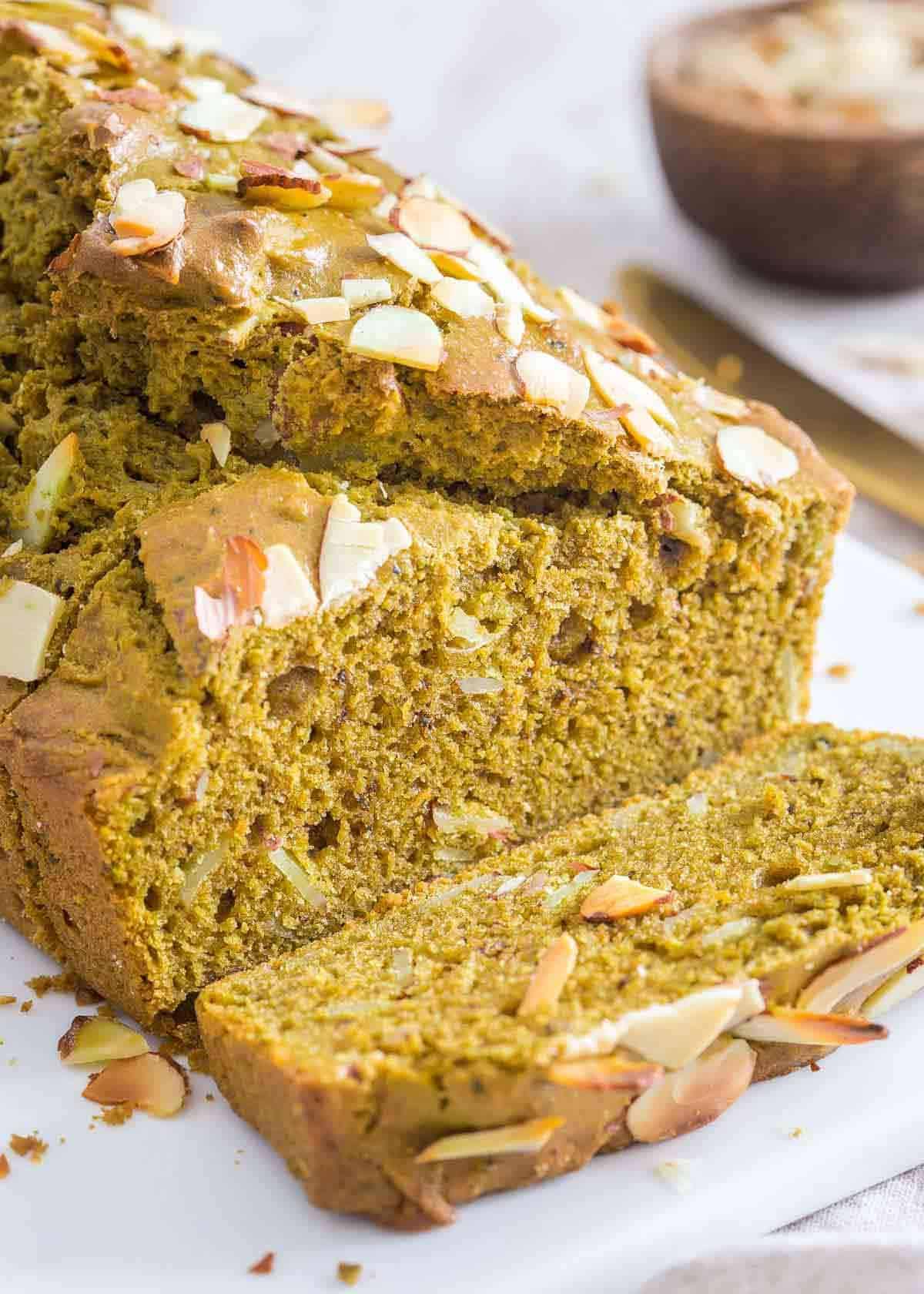 Matcha bread loaf with a slice.