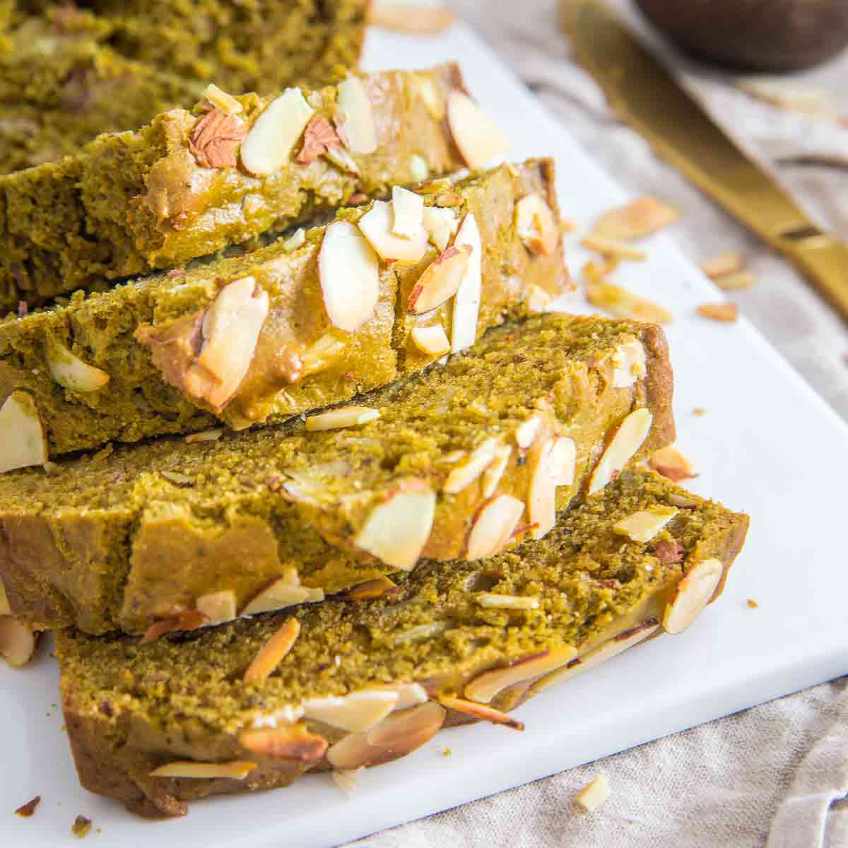 Green tea bread made with sliced almonds, almond flour and almond extract is packed with flavor in each moist slice.