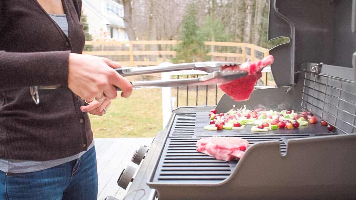 Grilled pork chops with grilled fennel grape salad is an easy meal made entirely on the Weber Genesis ii grill.