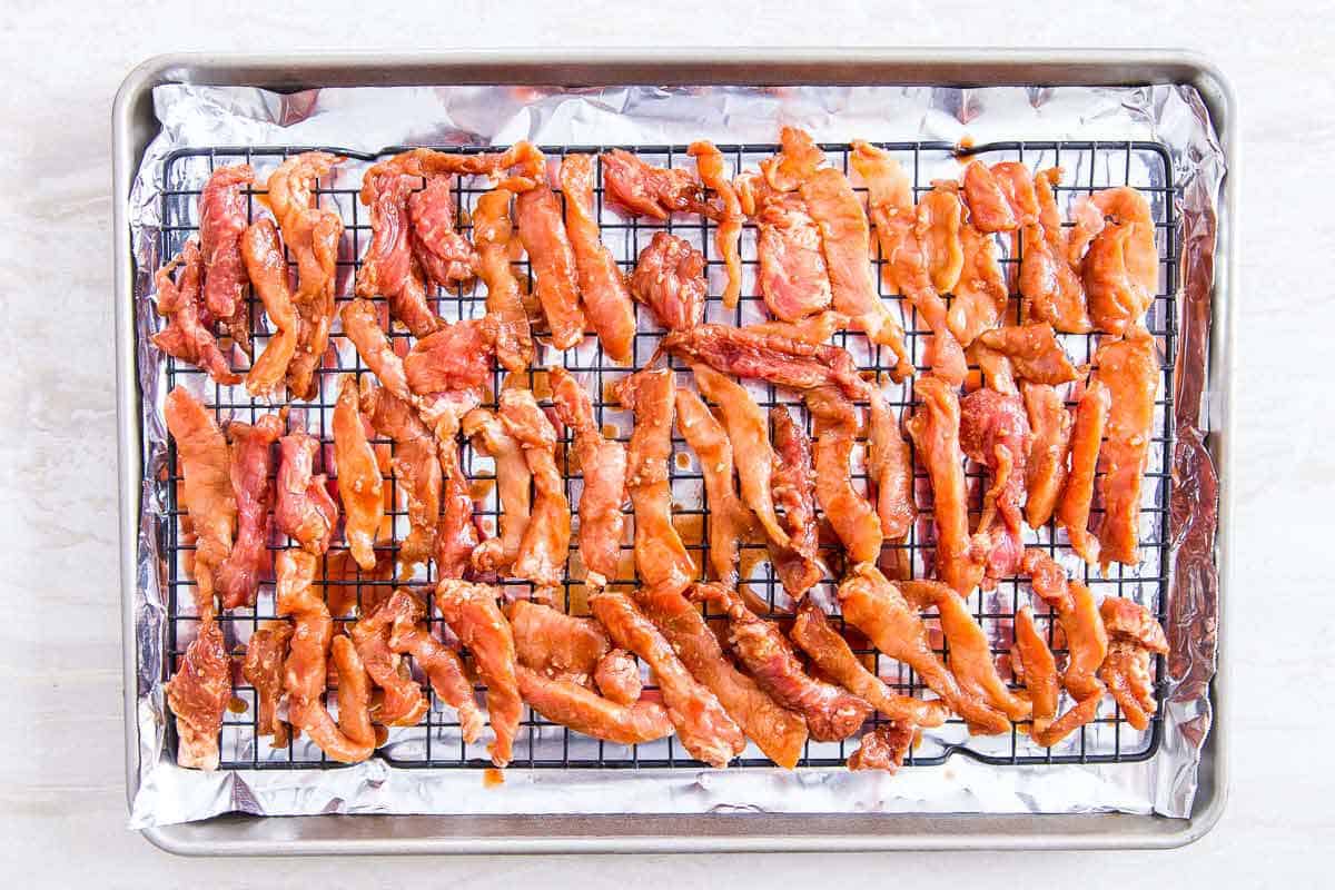 Chinese boneless spare ribs are baked on a rack in the oven for extra crispy edges.