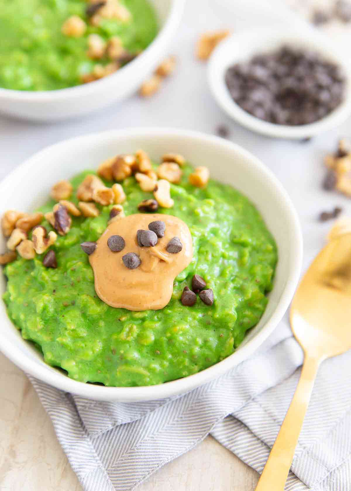 This green oatmeal is the perfect St. Patrick's Day breakfast recipe. Made with spinach, oats, bananas, milk it's a festive and healthy start to the day.