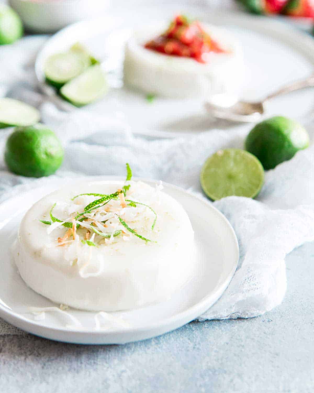 This key lime coconut panna cotta is made with coconut milk for a creamy, healthier twist to the classic recipe and topped with a key lime strawberry compote.