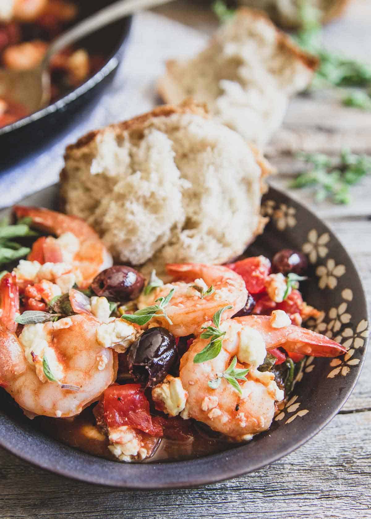 This easy Greek shrimp recipe is made entirely in the skillet with tomatoes, Kalamata olives, feta and lots of lemon and oregano.