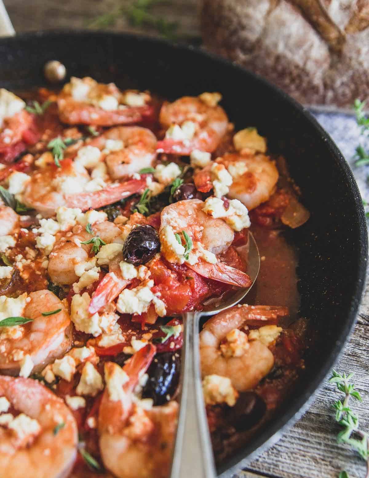 Greek shrimp made in the skillet is full of all the traditional Greek flavors you love and perfect served with some crusty bread or rice.